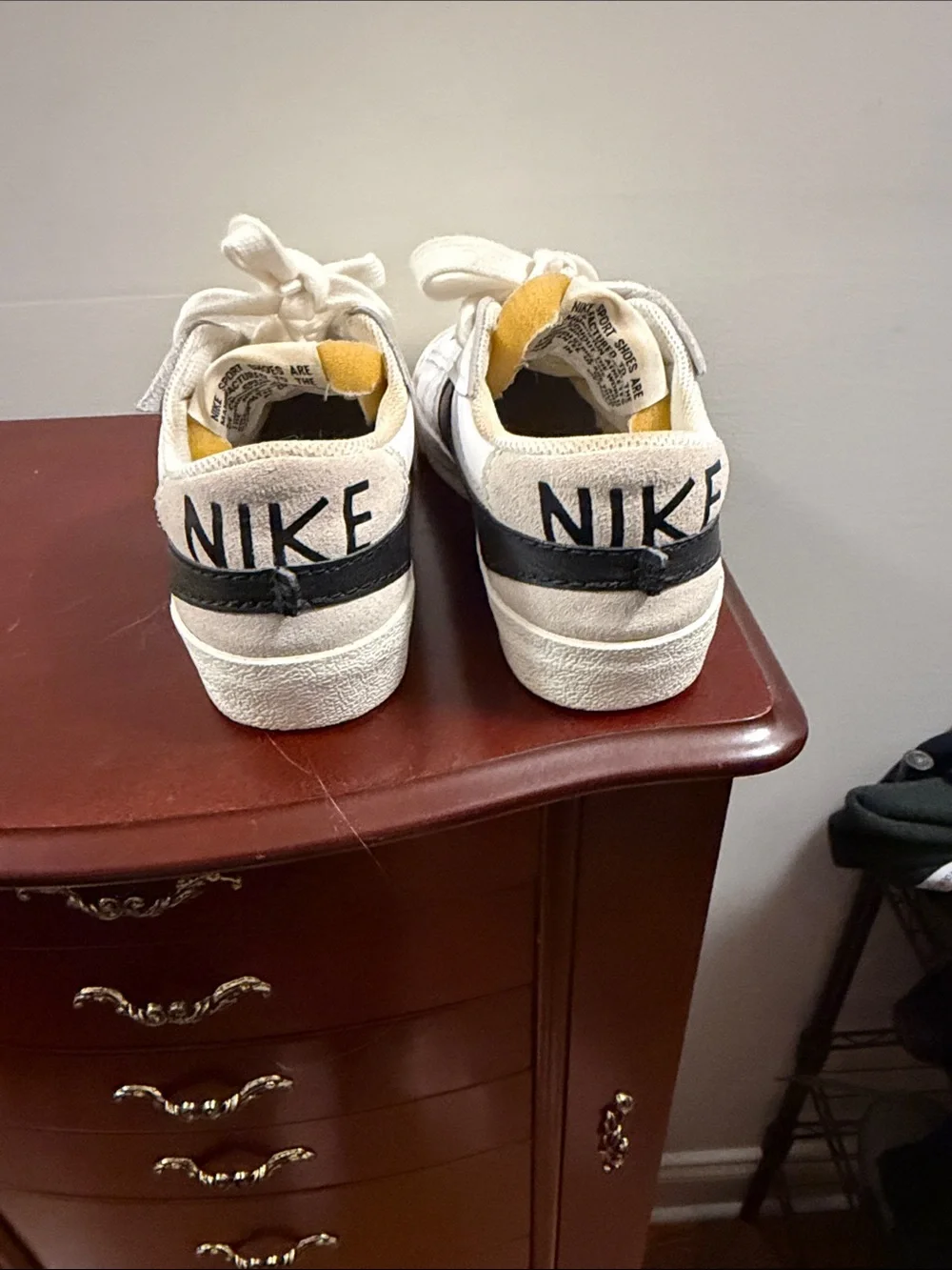 Nike White Sneakers with Black Swoosh and Cream Sole